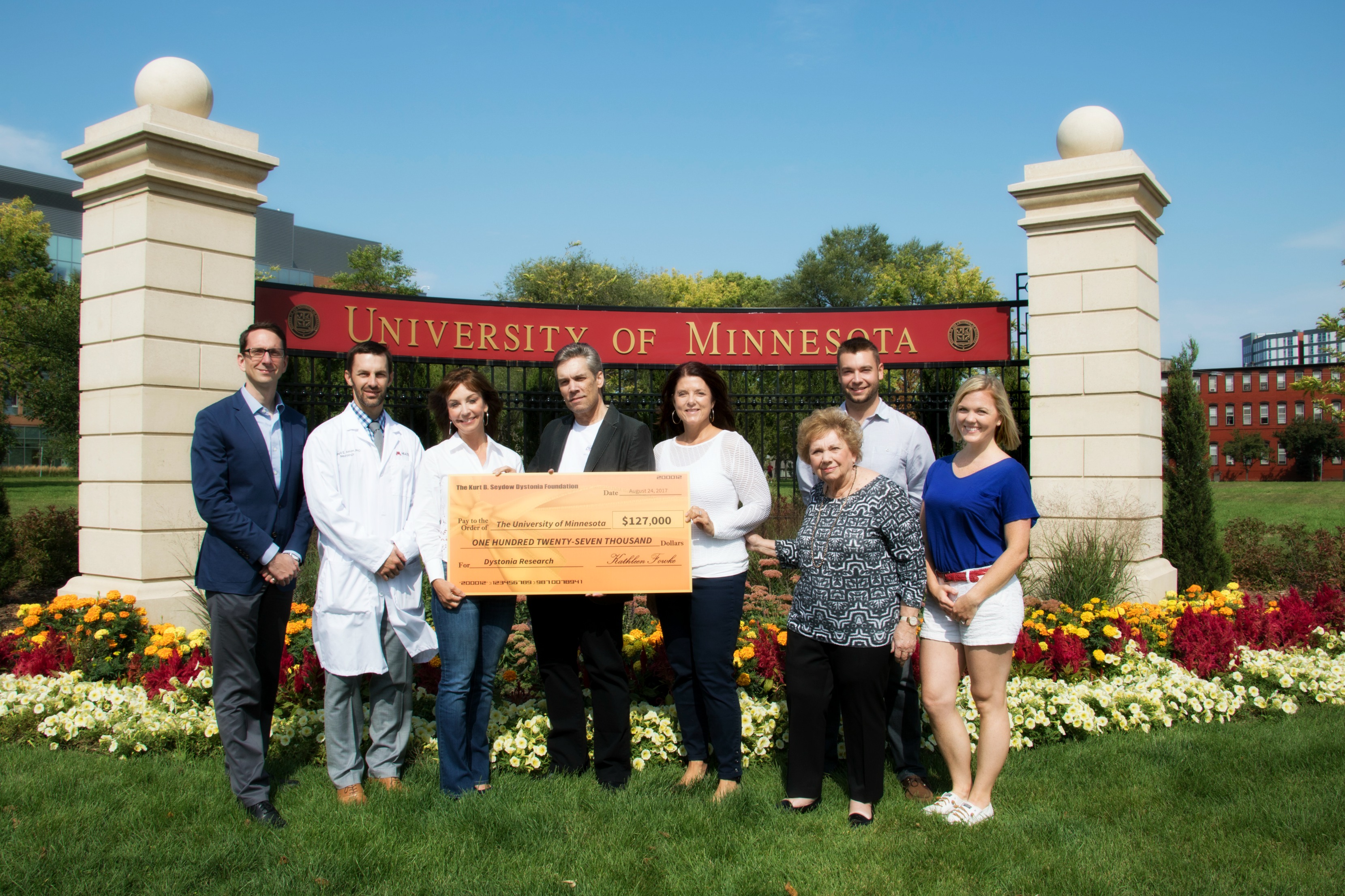 Group presenting check to U of M researchers